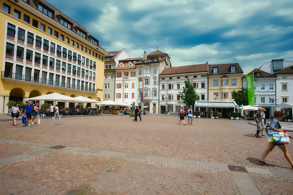 People crossing a sunny town square