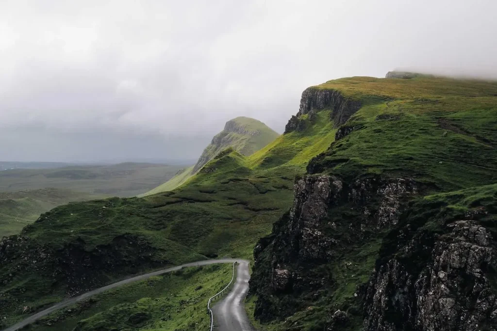 An empty road towards the mountains